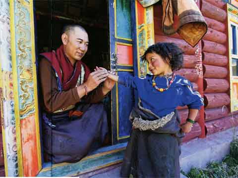 
A doctor take the pulse of a nomad girl from Tsatsa in eastern Tibet - Tibet An Inner Journey book
